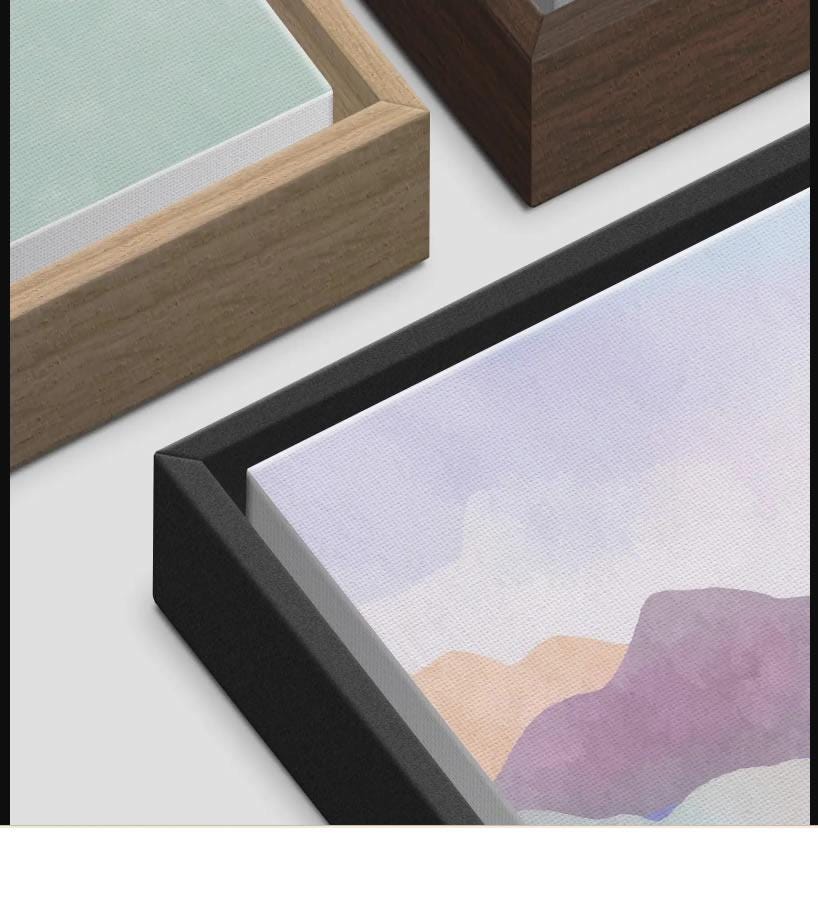 Three framed canvas corner samples in oak, dark walnut, and black frames